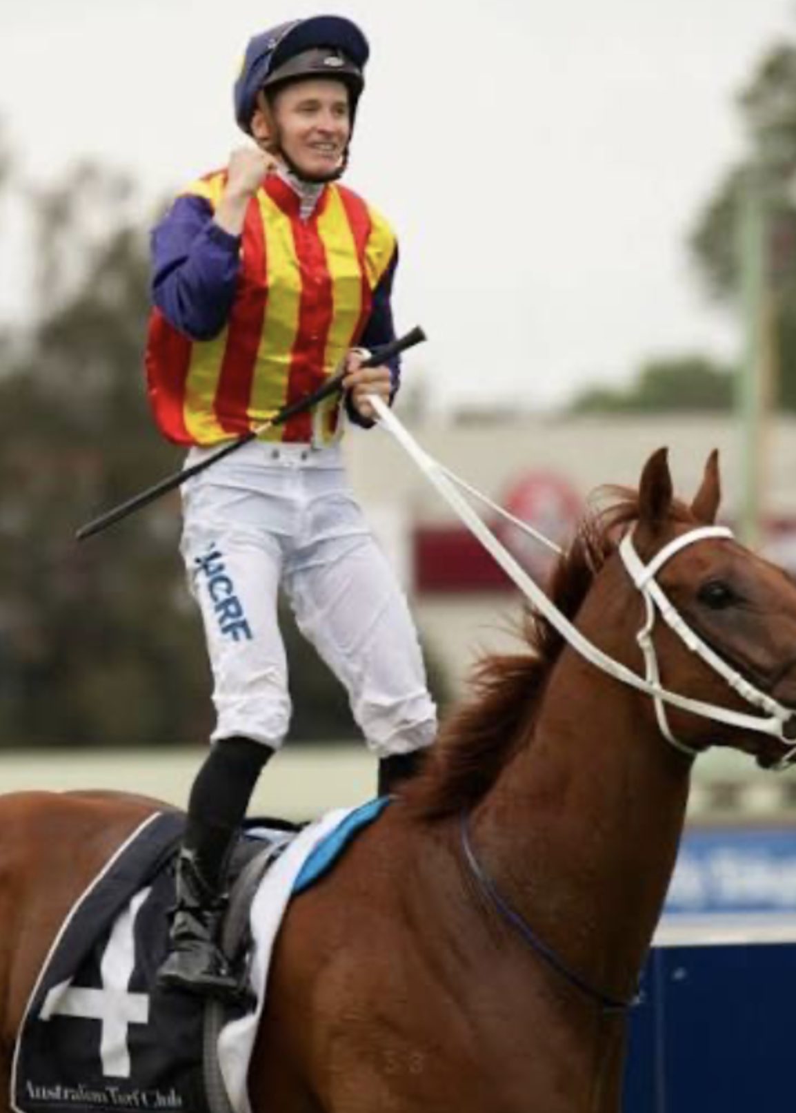 Taylor Marshall salutes after Spicy Martini's Stradbroke Handicap victory